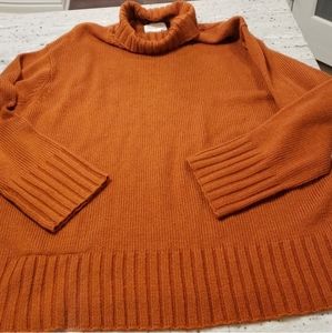 Copper colored loose turtleneck